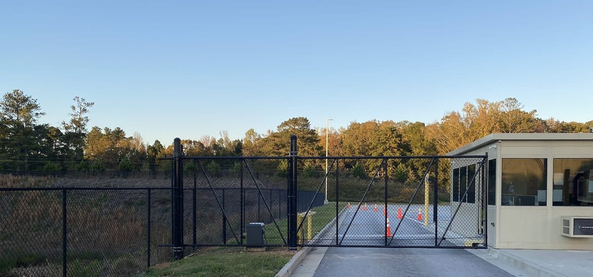 Black chain link security fence with commercial gate in Georgia