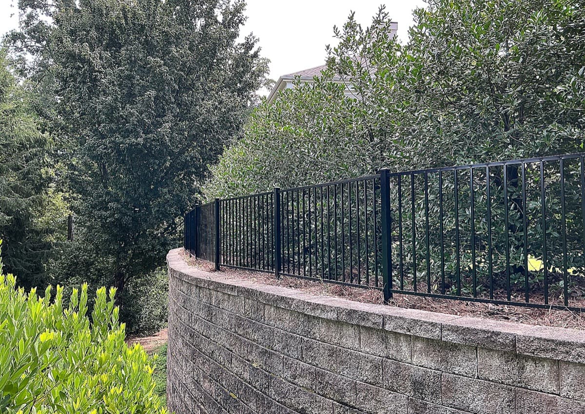 Smooth-top 2-rail black aluminum fence installation in Georgia