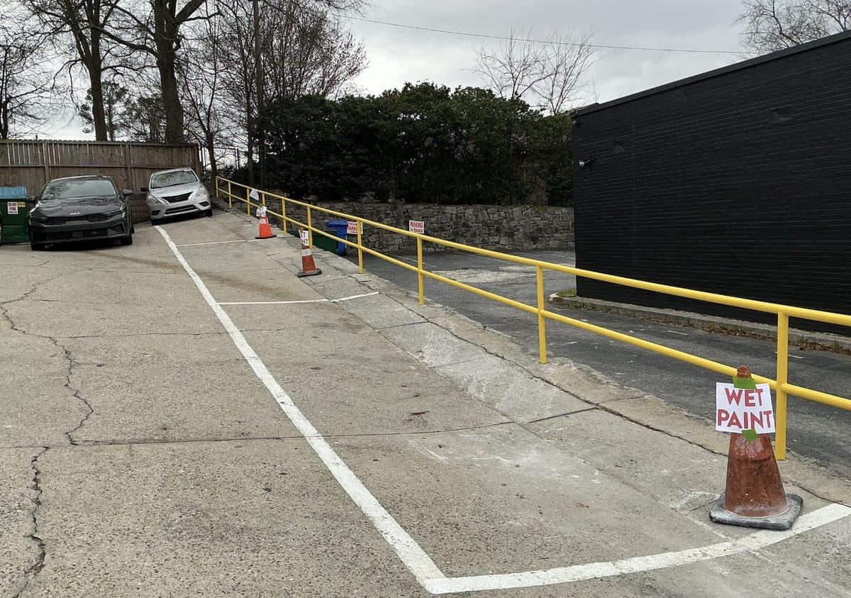 Yellow commercial safety railing in parking lot, Atlanta, GA